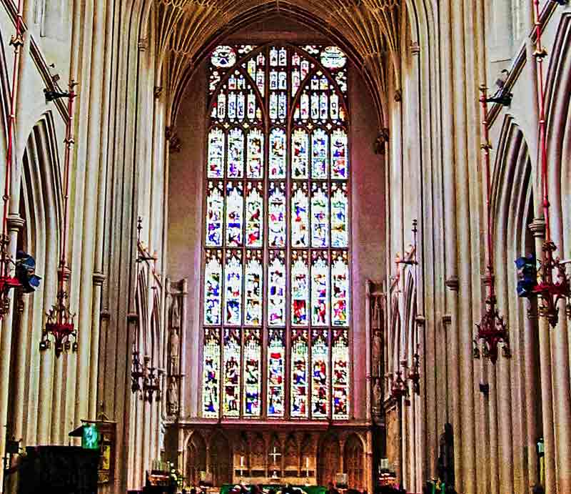 Stained glass and altar at the eastern end of the nave.
