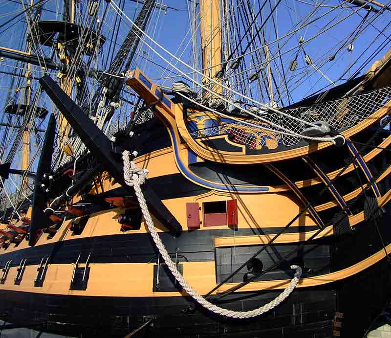 The yellow and black hull and rigging.