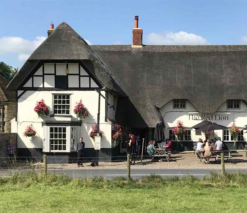 Frontage of the thatched roof timber framed pub.