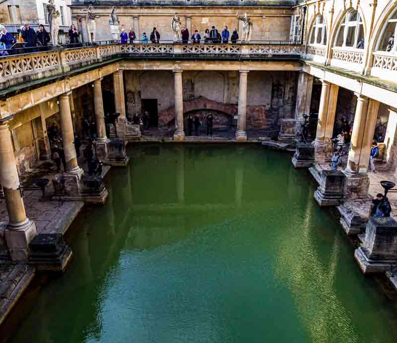 The waters and ancient stone architecture viewed from street level.