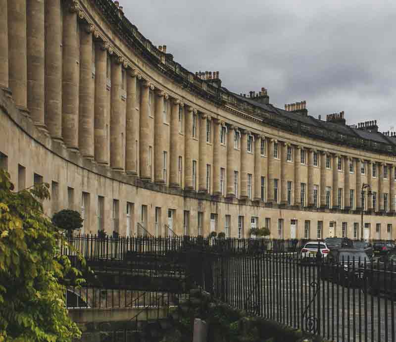 Curved Georgian facade showing ionic columns of the first floor.