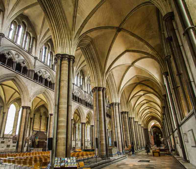 Interior bathed in natural light looking to vaulted ceiling.