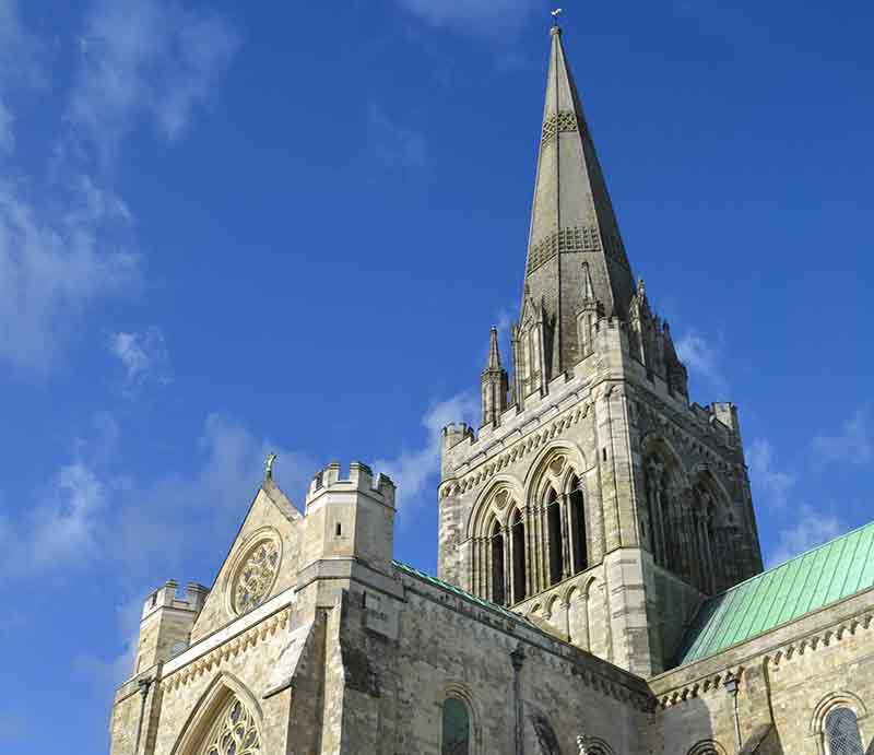 Looking up at the breathtaking spire beneath a blue sky.